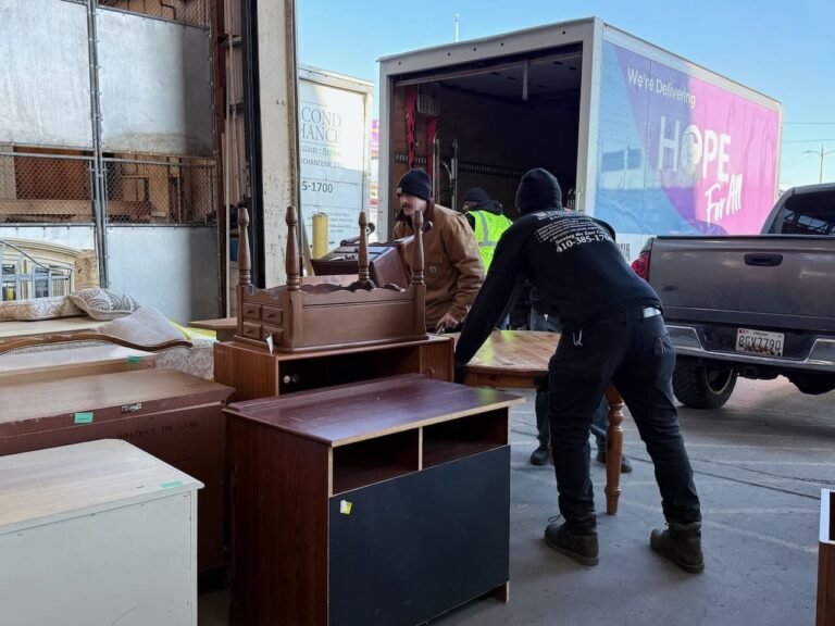 Two Second Chance, Inc. team members loading donated salvaged furniture, including vintage dressers and tables, to a truck from HOPE For All as an outbound donation.